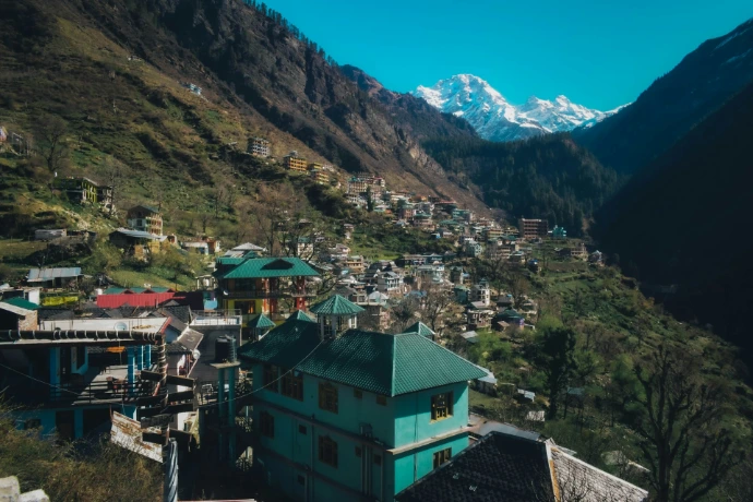 a view of a village in the mountains